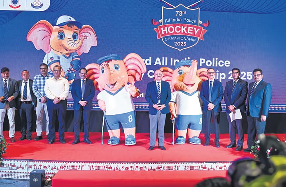 Odisha DGP YB Khurania and others pose along with mascot ‘ASHA’ after its launch during a curtain-raiser ceremony of the All India Police Hockey Championship-2025.